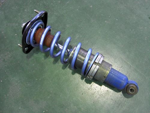 Rear damper removed from a Mazda Roadster (MX-5)
