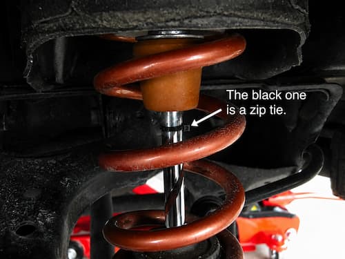Zip tie attached to the piston rod for measuring stroke