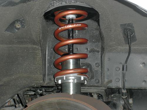 Unloaded coil spring with the vehicle lifted